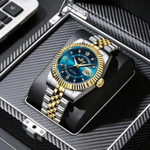 Close-up of gold-tone luxury watch with blue dial and date window in gift box