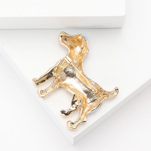 Detailed back view of golden alloy puppy brooch showing the secure metal safety pin clasp