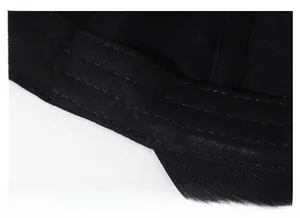 Macro detail of black cotton baseball cap with thick sweatband and precise stitching