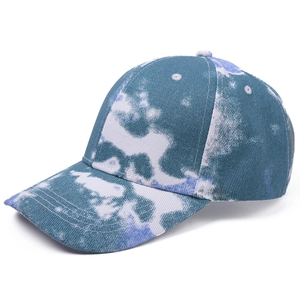 Detail view showing the blue and white tie-dye pattern on a classic cotton baseball cap