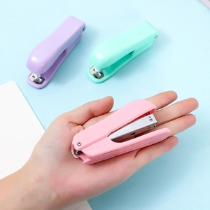 Mini macaron-colored staplers in purple, green, and pink colors for students and office