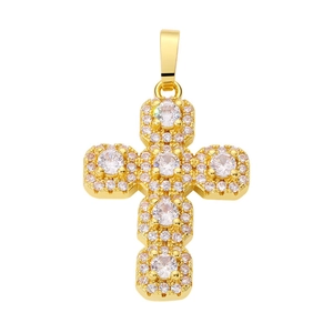 Detailed close-up of a golden cross pendant inlaid with sparkling cubic zirconia stones