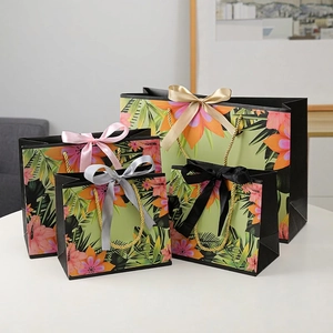 Tropical Floral Print Gift Paper Bags With Golden Rope Handles And Satin Ribbon Bow Elegant Hibiscus Palm Leaf Packaging
