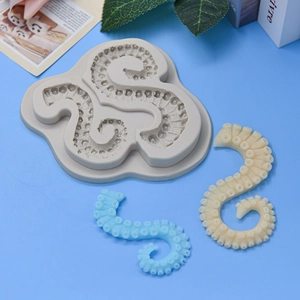 Silicone octopus tentacle mold for DIY cake decorating and baking crafts on blue background