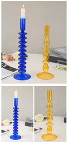 Detail of vintage blue ripple and amber bubble glass candle holders on a desktop