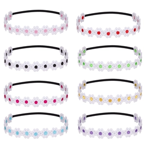 Detailed view of eight colorful embroidered daisy headbands with high elastic bands