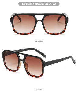 Classic double-bridge pilot sunglasses featuring black tortoiseshell frames and tea lenses