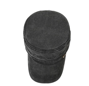 Detail view of washed vintage military cap with side leather patch and metal rivets