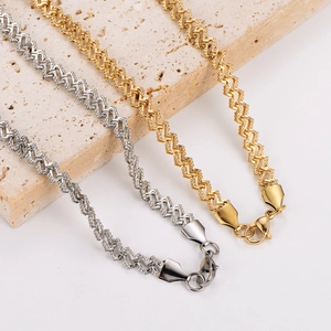 Minimalist stainless steel wave chain necklace in gold and silver on stone