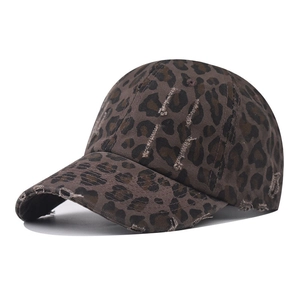 Vintage washed leopard print baseball cap with distressed details and frayed brim style