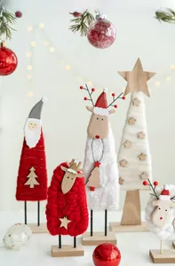 Detailed view of handcrafted wool felt Santa and reindeer holiday tabletop decorations