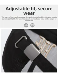 Detail of adjustable metal buckle and breathable woven fabric on black baseball cap
