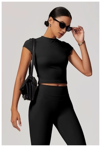 Slim fit black yoga crop top with high waist leggings made of high-stretch matte fabric