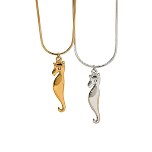 Polished seahorse pendant necklace in gold and silver with sleek snake chain and zircon eyes
