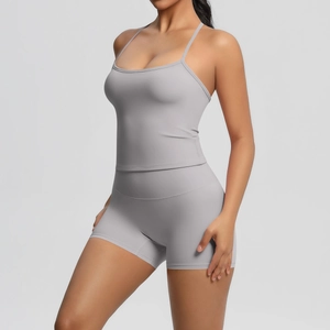 Detail view of light grey seamless brushed fabric on a women's sports vest and shorts set
