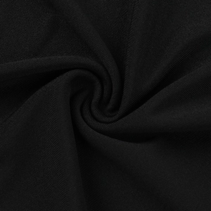Macro shot of soft black knit fabric texture with elegant pleats and draped details