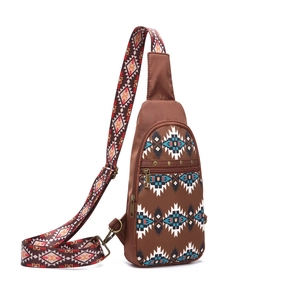 Detail of bohemian sling bag with Aztec tribal pattern and vintage bronze zipper