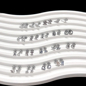 Detailed set of silver titanium steel earrings with heart star and butterfly shapes