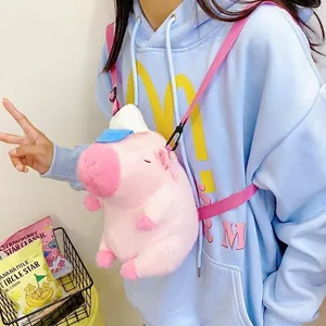 Close-up of pink pig plush crossbody bag with soft faux fur texture and nylon strap