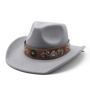 Detail of grey cowboy hat with turquoise buckle and embroidered brown leather band