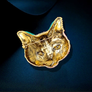 Vintage gold cat mask brooch made of alloy with a secure pin clasp on the back