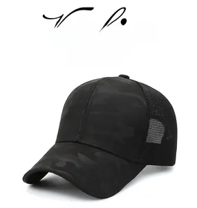 Detail of dark camouflage baseball cap showing breathable mesh back and curved brim