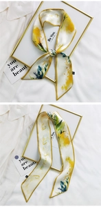 Detail of floral silk scarf hair tie with satin finish and yellow blue flower pattern