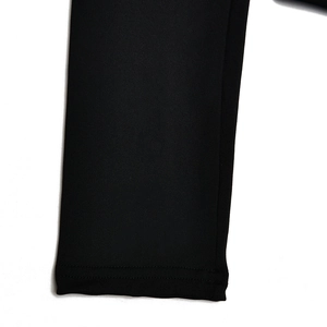 Detailed close-up of black high-elastic knitted fabric stitching on the sleeve cuff