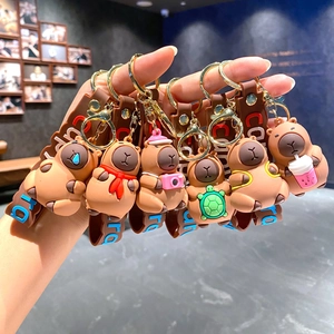 Cute Capybara keychains in various styles including scarf and camera designs