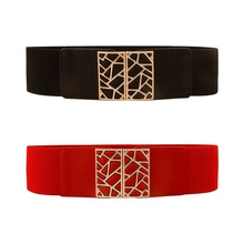 Detail view of black and red elastic wide belts with golden geometric metal buckles