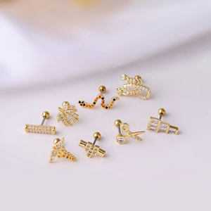 Set of 8 gold titanium steel stud earrings featuring snake, scorpion, and leaf designs