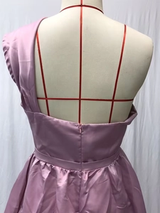 Detail view of the lilac satin evening dress featuring an invisible back zipper closure