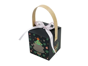 Detail of Christmas gift box with wooden handle, pink satin ribbon and Merry Christmas print
