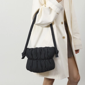 Stylish black puffer hobo bag for women with quilted nylon design and soft shoulder strap