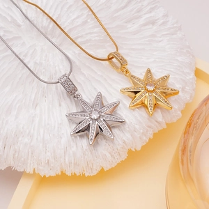 Elegant gold and silver star pendants with white cubic zirconia on snake bone chains