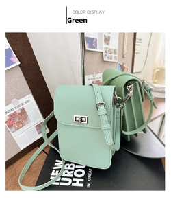Close-up of mint green Saffiano leather mini bag with silver metal twist lock