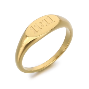 Minimalist gold oval signet ring featuring 11:11 engraved numbers in stainless steel