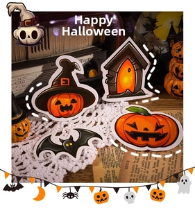 Close-up of Halloween stickers featuring pumpkins and ghosts on vintage radio background