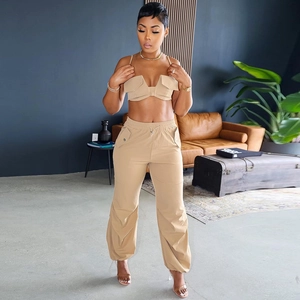 Detailed view of women's khaki utility two-piece set with crop top and cargo pants
