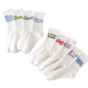 White mid-calf athletic cotton socks featuring various graffiti style letter prints