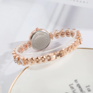 Detail of rose gold watch with stainless steel back and luxury bracelet design