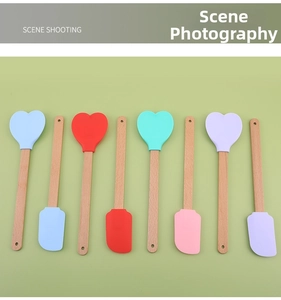Colorful heart-shaped silicone spatulas with natural beech wood handles in various bright shades