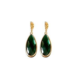 Elegant gold earrings with emerald green teardrop glass stones on white background