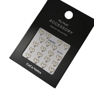 Gold-rimmed heart nail charms with white pearls on display card, 20-piece set
