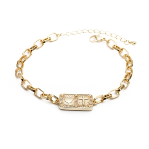 Adjustable gold chain bracelet with zircon heart and cross pendant on a white background