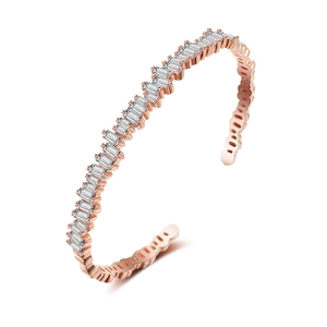 Detail shot of rose gold open bracelet featuring rectangular zircon pave setting
