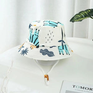 White cotton kids sun hat featuring blue zebra and plant prints with adjustable chin strap