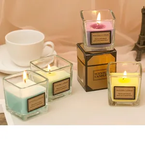Colorful square glass scented candles in various pastel shades with minimalist packaging