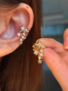 Detailed macro view of star-shaped ear cuff featuring white cubic zirconia inlay craftsmanship
