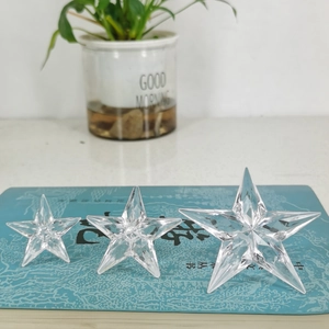 Three transparent crystal star ornaments in different sizes for Christmas decoration